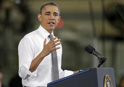 President Barack Obama speaks to workers and guests at the Linamar Corporation plant in Arden, N.C., Wednesday, Feb. 13, 2013, as he travels after delivering his State of the Union address Tuesday. (AP Photo/Chuck Burton)