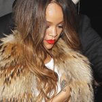 Rihanna shows off a toned stomach as she arrives at the after party (Splash News)