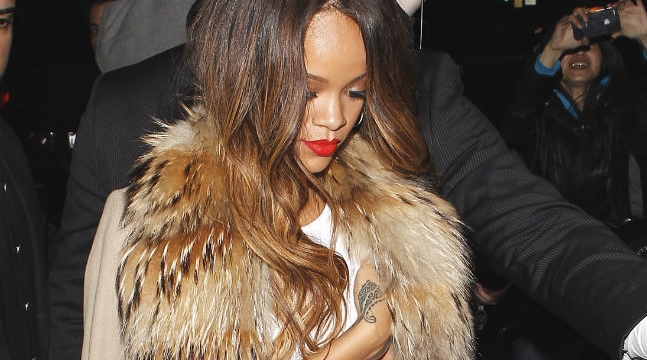 Rihanna shows off a toned stomach as she arrives at the after party (Splash News)