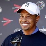Tiger Woods of the U.S. laughs during a news conference before a practice round for the WGC-Accenture Match Play Championship golf tournament in Marana, Arizona February 19, 2013. REUTERS/Matt Sullivan