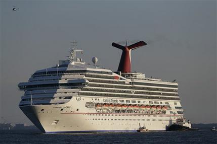 FILE - In this Feb. 14, 2013 file photo the cruise ship Carnival Triumph is towed into Mobile Bay near Dauphin Island, Ala., Thursday, Feb. 14, 2013. A leak in a fuel oil return line caused the engine-room fire that disabled a Carnival cruise ship at sea, leaving 4,200 people without power or working toilets for five days, a Coast Guard official said Monday, Feb. 18, 2013. (AP Photo/Dave Martin, File)