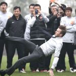 David Beckham fell over in a suit and everyone took a photo
