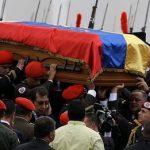 Venezuela's late president Chavez makes final journey