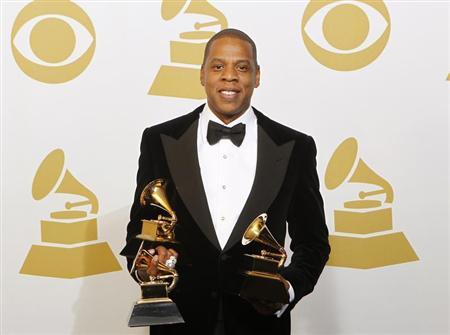 Jay-Z poses with the awards he won for Best Rap Performance, Best Rap/Sung Collaboration and Best Rap Song backstage at the 55th annual Grammy Awards in Los Angeles, California February 10, 2013. REUTERS/Mario Anzuoni