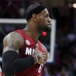 Miami Heat's LeBron James (6) reacts after scoring in the fourth quarter of an NBA basketball game against the Cleveland Cavaliers on Wednesday, March 20, 2013, in Cleveland. James scored a team-high 25 points in Miami's 98-95 win. (AP Photo/Tony Dejak)