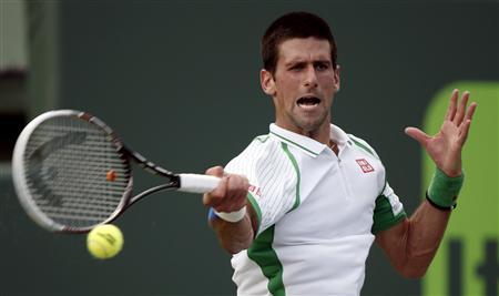 Novak Djokovic of Serbia hits a forehand to Somdev Devvarman of the Netherlands during their match at the Sony Open tennis tournament in Key Biscayne, Florida March 24, 2013. REUTERS/Kevin Lamarque