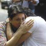 Bollywood actor Sanjay Dutt (R) embraces his sister Priya Dutt after breaking down during a news conference outside his residence in Mumbai March 28, 2013. REUTERS/Stringer