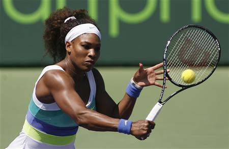 Serena Williams hits a backhand against Italy's Flavia Pennetta at the Sony Open tennis tournament in Key Biscayne, Florida March 21, 2012. REUTERS/Andrew Innerarity