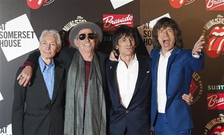 The Rolling Stones (L-R) Charlie Watts, Keith Richards, Ronnie Wood and Mick Jagger pose as they arrive for the opening of the exhibition "Rolling Stones: 50" at Somerset House in London, in this July 12, 2012 file picture. REUTERS/Ki Price/File