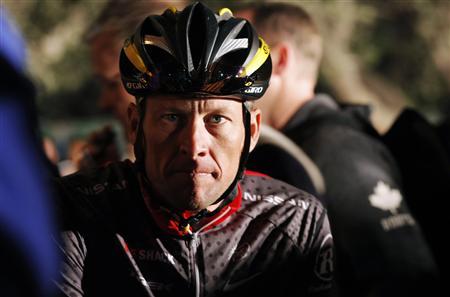 Seven-time Tour de France winner Lance Armstrong awaits the start of the 2010 Cape Argus Cycle Tour in Cape Town in this March 14, 2010 file photo. A spate of troubling stories in the first quarter of 2013 show an altogether darker and more disturbing side to the glamorous, multi-billion-dollar global sport industry. In January, American cyclist Armstrong admitted in a television interview that he had doped before each of his record seven Tour de France victories. His confession after years of denial followed the United States Anti-Doping Agency's (USADA) decision to strip him of the title and accuse him of being at the centre of the "most sophisticated, professionalised and successful doping programme that sport has ever seen". REUTERS/Mike Hutchings/Files