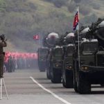 A North Korean soldier films military vehicles carrying missiles during a parade to commemorate the 65th anniversary of founding of the Workers' Party of Korea in Pyongyang October 10, 2010. REUTERS/Petar Kujundzic