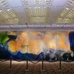 A visitor looks at a 2.8-metre by 10-metre triptych by Chinese painter Zao at Christie's auction house in Hong Kong. REUTERS/Bobby Yip