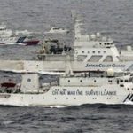 Japan PM Abe warns China of force over islands landing