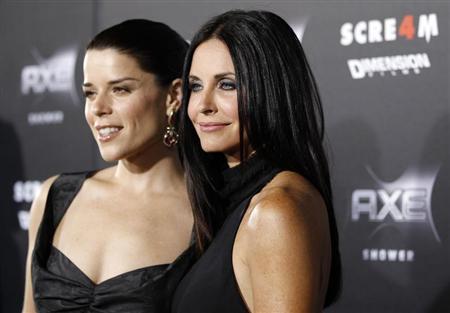 Cox and Campbell pose at the premiere of "Scream 4" at the Grauman's Chinese theatre in Hollywood