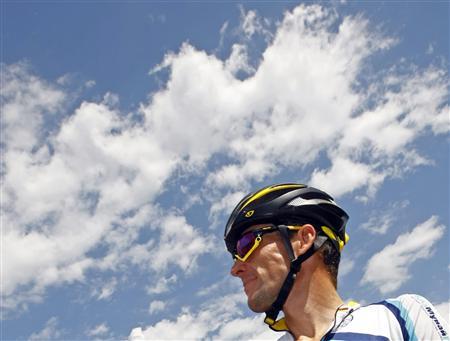 Astana rider Lance Armstrong of the U.S. awaits the start of the 19th stage of the 96th Tour de France cycling race between Bourgoin-Jailleu and Aubenas, July 24, 2009. REUTERS/Bogdan Cristel