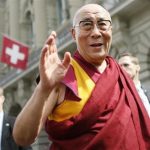 Tibet's exiled spiritual leader the Dalai Lama waves to spectators outside the Swiss Parliament building during his visit to Bern April 16, 2013. REUTERS/Pascal Lauener