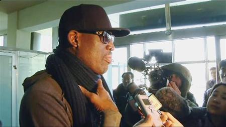 Former U.S. NBA basketball player Dennis Rodman speaks to the media at the airport before departing Pyongyang, March 1, 2013 in this still image taken from video. Rodman watched a basketball match with North Korean leader Kim Jong-un and his wife Ri Sol-ju in Pyongyang on Thursday, North Korea state media reported. REUTERS/KCNA for Reuters TV