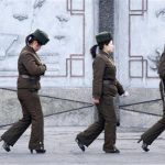 Female North Korean soldiers patrol along the banks of Yalu River, near the North Korean town of Sinuiju, opposite the Chinese border city of Dandong, April 11, 2013. REUTERS/Jacky Chen