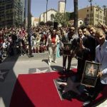 Backstreet Boys (from L-R) A. J. McLean, Howie Dorough, Kevin Richardson, Nick Carter and Brian Littrell pose by their star after it was unveiled on the Walk of Fame in Los Angeles, California April 22, 2013. REUTERS/Mario Anzuoni