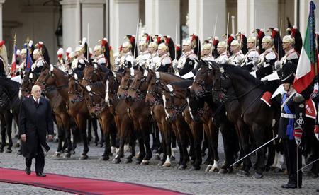 Italy's newly re-elected president Giorgio Napolitano inspects a guard of honor during a welcoming ceremony at the Quirinale palace in Rome, April 22, 2013. REUTERS/Max Rossi