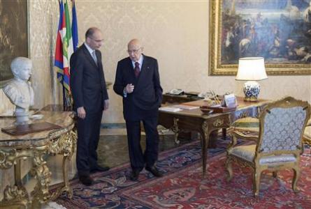 Newly appointed Italian Prime Minister Enrico Letta (L) and Italian President Giorgio Napolitano are seen before the swearing in ceremony of the new government at Quirinale palace in Rome in this picture provided by the Italian Presidency Press Office April 28, 2013. REUTERS/Italian Presidency Press Office/Handout