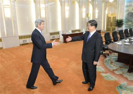 U.S. Secretary of State John Kerry (L) shakes hands with Chinese President Xi Jinping before their meeting at the Great Hall of the People in Beijing April 13, 2013. REUTERS/Yohsuke Mizuno/Pool