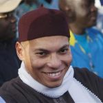Karim Wade (C), son of Senegal's former president Abdoulaye Wade, attends a rally of his father's political party Parti Democratique Senegalais (PDS) in Dakar, in this file picture taken December 6, 2012. REUTERS/Joe Penney/Files