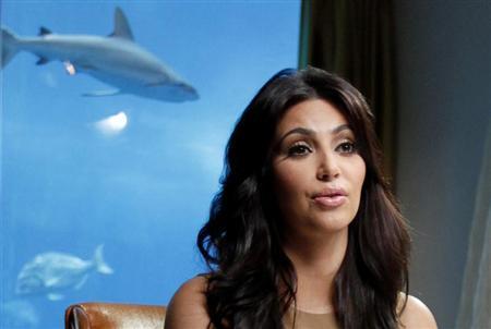 TV personality and actress Kim Kardashian speaks during an interview with Reuters in Dubai October 13, 2011. REUTERS/Jumana El Heloueh