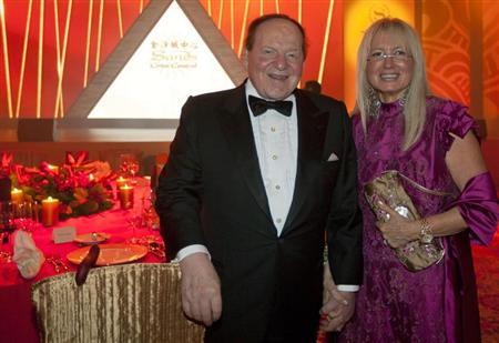 Las Vegas Sands Chairman and CEO Sheldon Adelson and his wife Miriam Ochsorn (R) pose for a photo during the opening ceremony of Sheraton Macao hotel at Sands Cotai Central in Macau September 20, 2012. REUTERS/Tyrone Siu