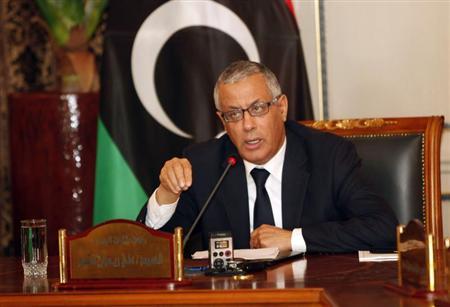 Libya's Prime Minister Ali Zeidan (C) speaks during a joint news conference at the headquarters of the Prime Minister's Office in Tripoli March 31, 2013. REUTERS/Ismail Zitouny