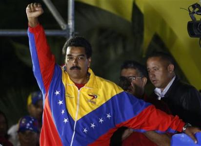 Venezuelan presidential candidate Nicolas Maduro celebrates after the official results gave him a victory in the balloting, in Caracas April 14, 2013. REUTERS/Tomas Bravo