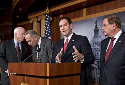 FILE In this Jan. 28, 2013, file photo Sen. Marco Rubio, R-Fla., center, speaks at a Capitol Hill news conference on immigration legislation with a members of a bipartisan group of leading senators, including, from left, Sen. John McCain, R-Ariz., Sen. Chuck Schumer, D-N.Y. and Sen. Robert Menendez, D-N.J., in Washington. After months of arduous closed-door negotiations, the Gang of Eight senators equally divided between the two parties had no issues left to resolve in person, and no more negotiating sessions were planned. Remaining details were left to aides, who were at work completing drafts of the bill. (AP Photo/J. Scott Applewhite, File)