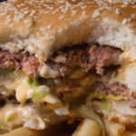 A photo of a partially eaten McDonalds' Big Mac hamburger atop French Fries, November 2, 2010. AFP Photo/Paul J. Richards (Photo credit should read PAUL J. RICHARDS/AFP/Getty Images)