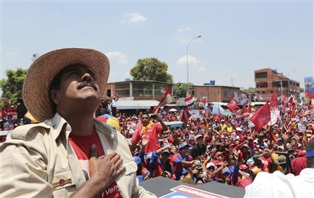 Venezuela's acting President and presidential candidate Nicolas Maduro greets supporters during a campaign rally at the state of Apure, in this picture provided by Miraflores Palace on April 7, 2013. REUTERS/Miraflores Palace/Handout
