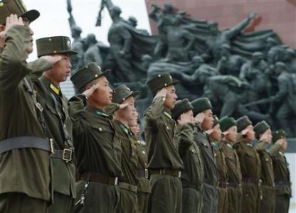 North Korean soldiers salute at Mansudae in Pyongyang, in this photo taken and provided by Kyodo April 15, 2013, the birthday of North Korea founder Kim Il-sung. Mandatory Credit REUTERS/Kyodo
