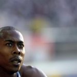 Shawn Crawford of the U.S. checks the scoreboard after the men's 200 meters semi-final during the world athletics championships at the Olympic stadium in Berlin August 19, 2009. REUTERS/Michael Dalder