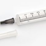 BX92YY Syringe isolated on a white background. File contains a path to cut.