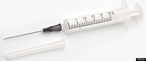 BX92YY Syringe isolated on a white background. File contains a path to cut.