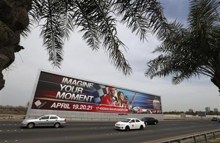 Vehicles travel past a large Bahrain Formula One advertising billboard on main highway leading to Bahrain Internaitonal Circuit, in Manama April 9, 2013. B REUTERS/Hamad I Mohammed