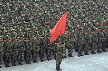 Chinese soldiers prepare to start a march drill on the outskirts of Hefei, east China's Anhui province October 15, 2007. REUTERS/Jianan Yu
