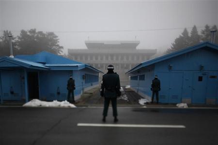 South Korean soldiers keep watch on the north at the "Truce Village" of Panmunjom in the demilitarised zone, which separates the two Koreas, in Paju, north of Seoul February 27, 2013. REUTERS/Kim Hong-Ji