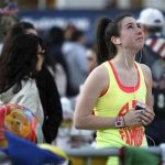 A woman looks up as she visits a memorial for the victims of the Boston Marathon bombings on Boylston Street in Boston, Massachusetts April 24, 2013. REUTERS/Jessica Rinaldi