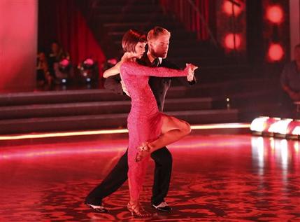 This May 13, 2013 photo released by ABC shows country singer Kellie Pickler and her partner Derek Hough performing on the celebrity dance competition series "Dancing with the Stars," in Los Angeles. Pickler is one of four celebrities competing in the finals Monday, May 20.  A winner will be announced on Tuesday. (AP Photo/ABC, Adam Taylor)