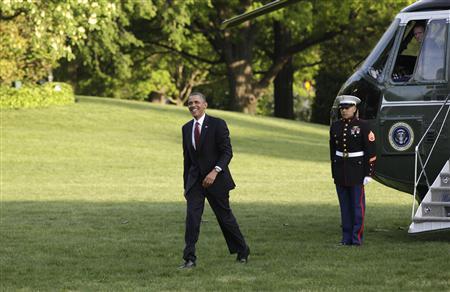 U.S. President Barack Obama smiles as he walks on the South Lawn of the White House upon his return to Washington from Costa Rica May 4, 2013. REUTERS/Yuri Gripas