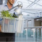 Man carrying business objects