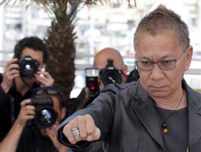 Director Takashi Miike poses during a photocall for the film "Wara No Tate" (Shield of Straw) at the 66th Cannes Film Festival in Cannes May 20, 2013. REUTERS/Regis Duvignau