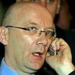 Bosnian Croat war time leader Jadranko Prlic, who is also a Croatian citizen, talks on a phone before departing for [The Hague] from Zagreb airport April 5, 2004.