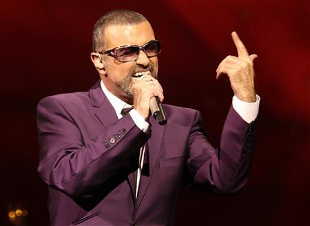 British singer George Michael performs on stage during his "Symphonica" tour concert in Vienna September 4, 2012. REUTERS/Heinz-Peter Bader