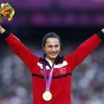 Gold medallist Turkey's Asli Cakir Alptekin smiles during the women's 1500 victory ceremony at the London 2012 Olympic Games at the Olympic Stadium August 11, 2012. REUTERS/Eddie Keogh