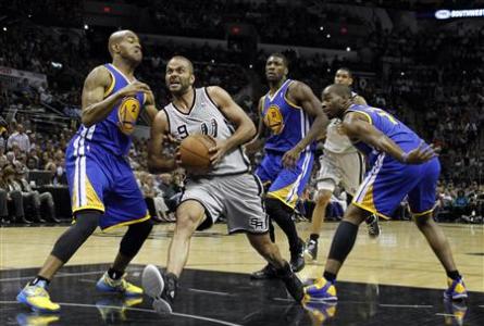 San Antonio Spurs guard Tony Parker (2nd L) drives on Golden State Warriors guard Jarrett Jack (L) as center Festus Ezeli (2nd R) and forward Carl Landry defend during the second half of their NBA Western Conference quarterfinal playoff basketball game in San Antonio, Texas May 8, 2013. REUTERS/Mike Stone